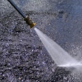 What are the essential safety precautions to follow when pressure washing?